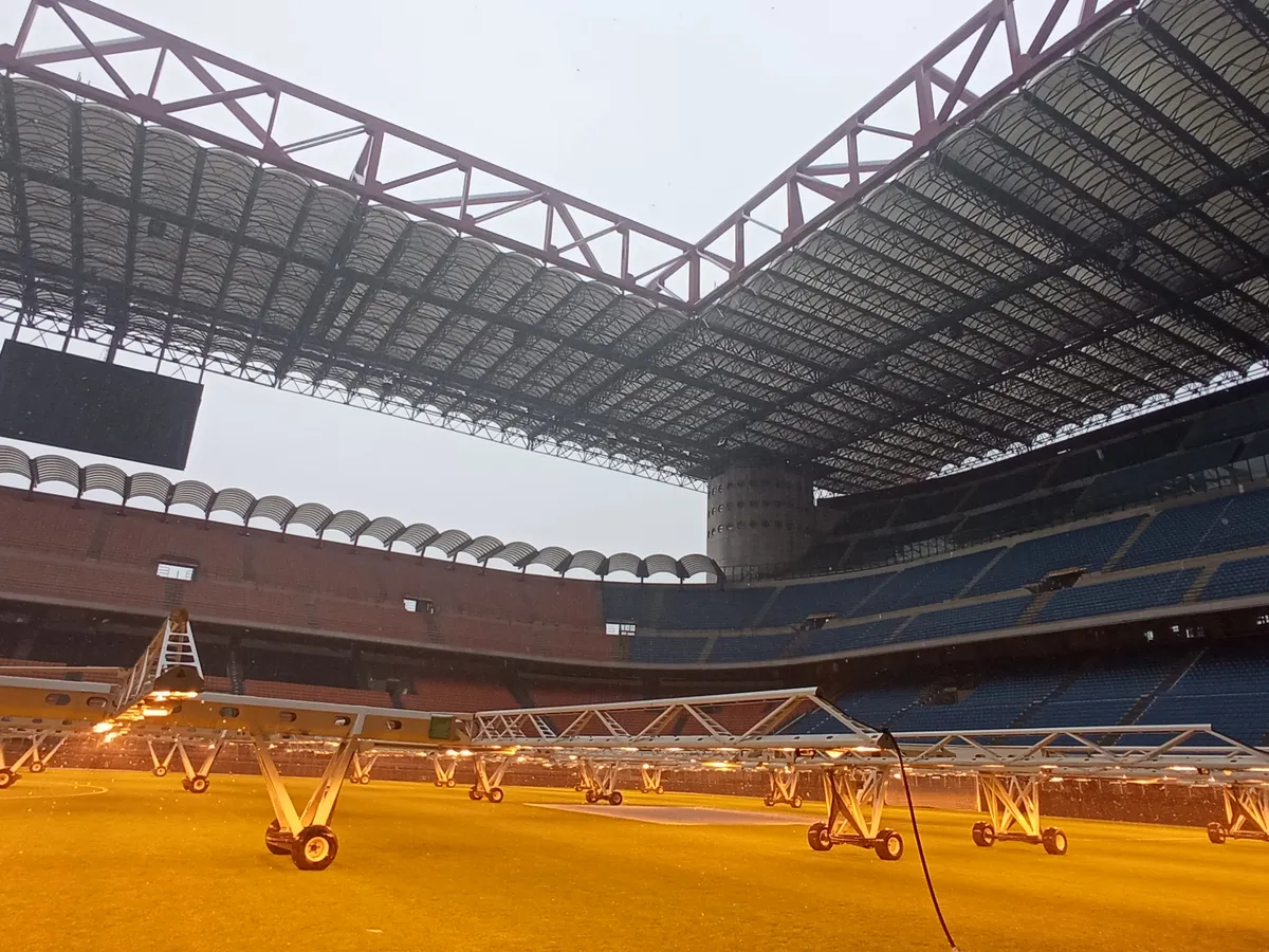 The inside of Stadio Giuseppe Meazza with grow lights on the pitch, seen on a San Siro stadium tour in Milan