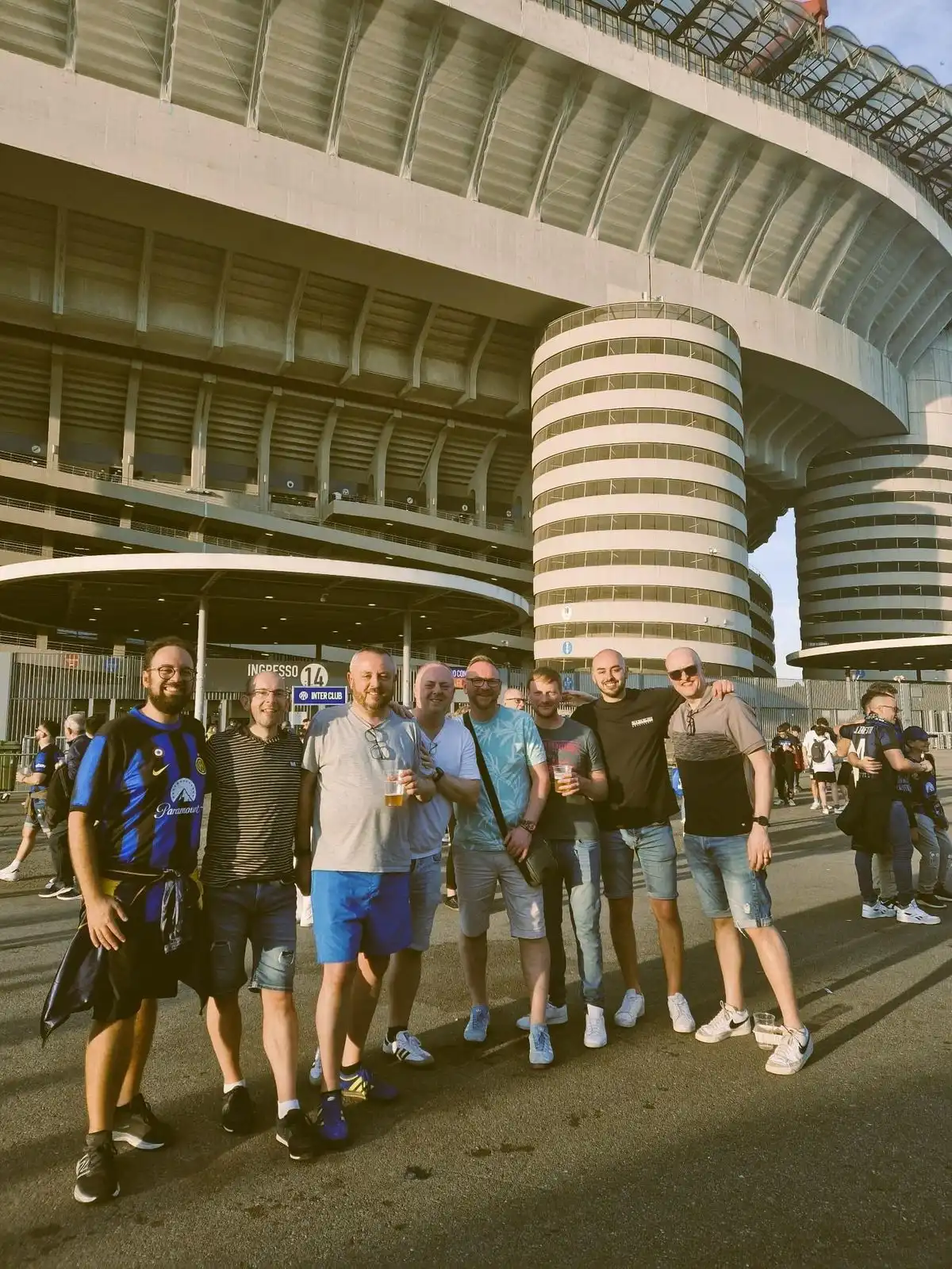 Fans in the stands on a matchday Milan stadium tour experience at San Siro